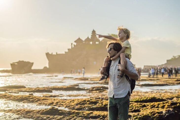father son tourists background tanah lot temple ocean bali indonesia traveling with children concept 247622 12521